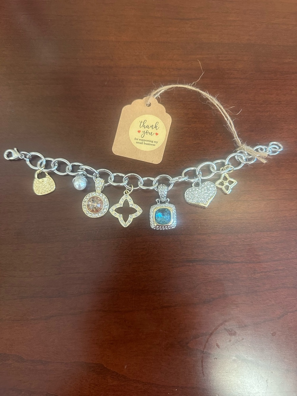 Silver and Gold Tone Charm Bracelet with Blue and Clear Gem Accents